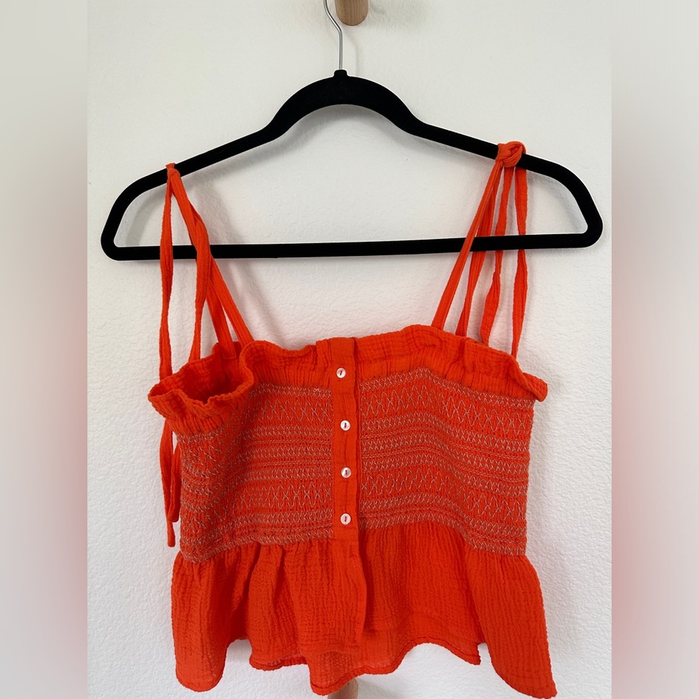 Free People NWT orange gauze peplum top with bow straps